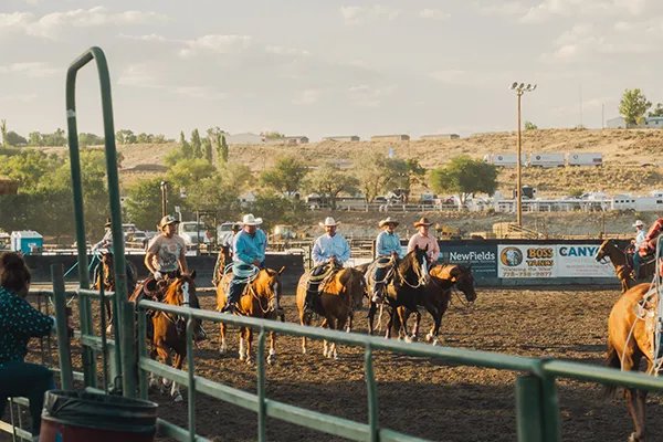 Men in cowboy hats on horseback at Elko County Fair